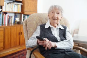 90 year old lady at home with her tv chair remote this file has a professional witnessed model and t20 rKalZz scaled